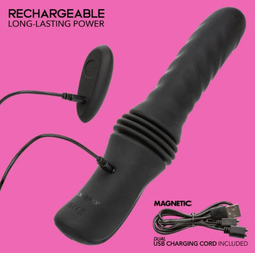Overdrive Waterproof Thruster Sex Machine Black with magnetic dual USB charging cord on a pink background.