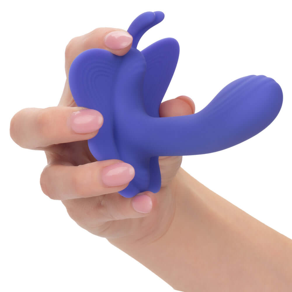 Hand holding CalExotics Connect Venus Butterfly stimulator in periwinkle color