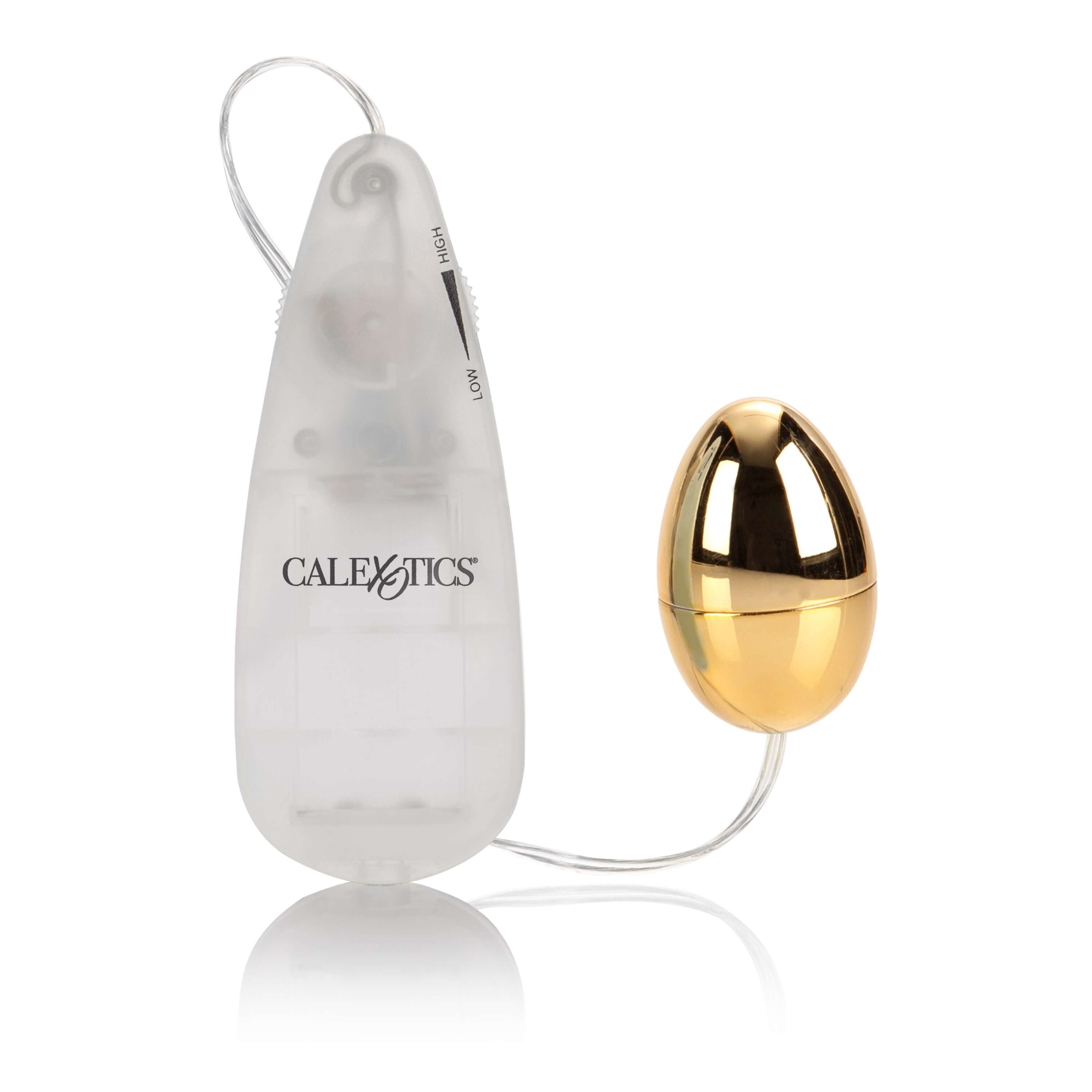 Pocket Exotics Vibrating Egg Gold next to its remote control, showcasing a sleek design and compact size.
