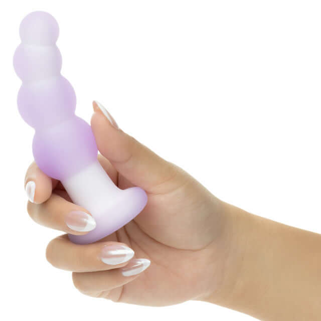 Hand holding Lavender Haze Beaded Curved Probe Purple, featuring a textured beaded design and smooth ergonomic shape.
