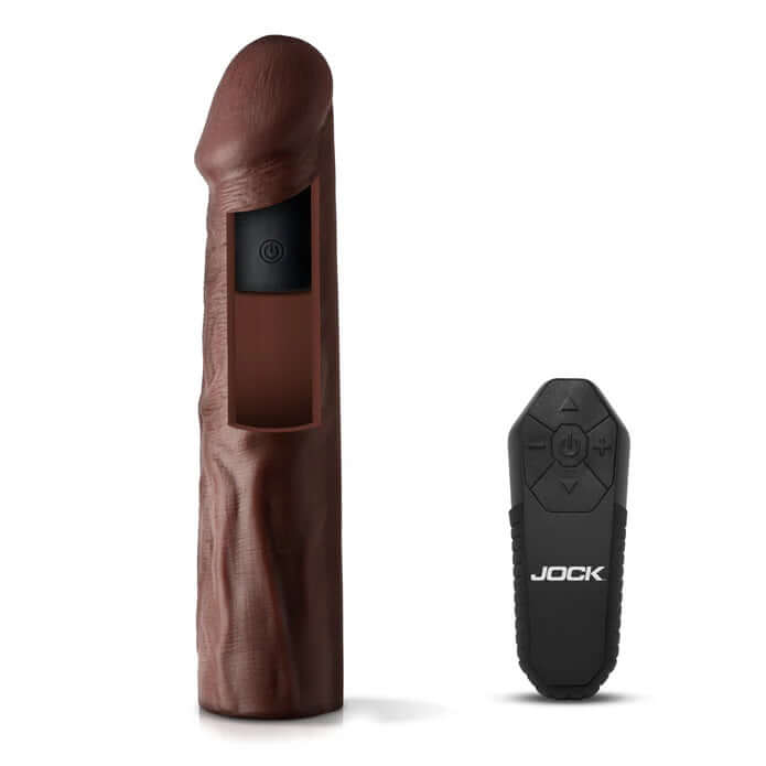 Jock Vibrating Penis Extension with Remote Dark next to its remote control, showcasing realistic design and powerful vibrations.