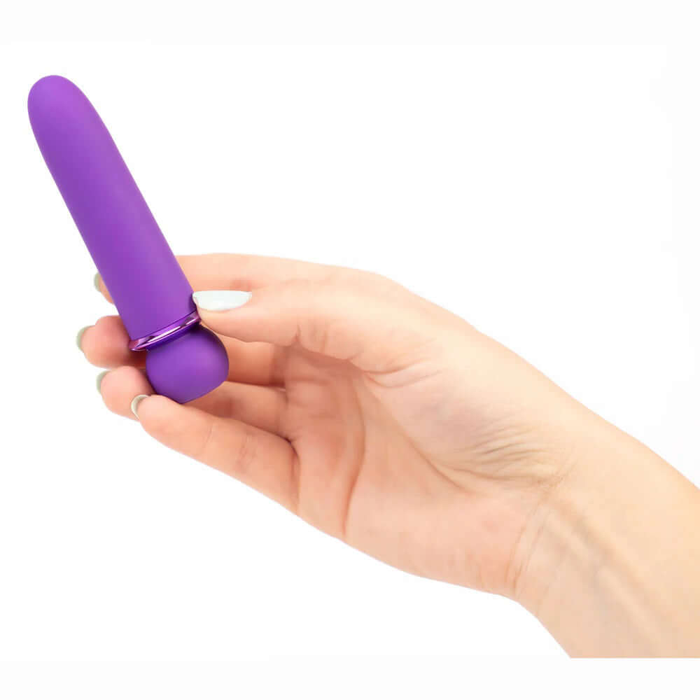 Hand holding the Maia Novelties Jaguar Fiercely Powerful in Purple, a 10-function, silicone-coated bullet vibrator with 5 speeds and patterns.