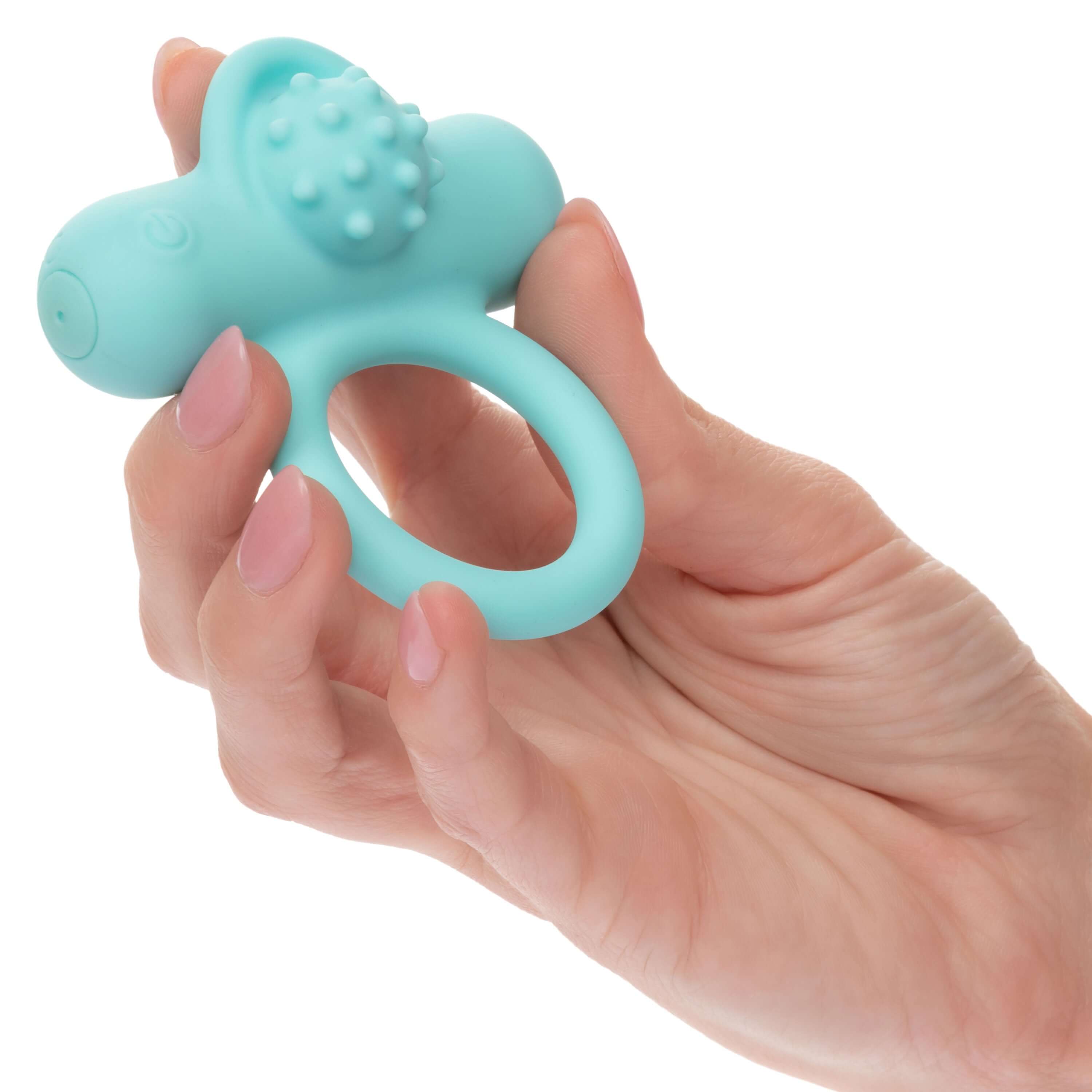 Silicone Rechargeable Nubby Lovers Ring Delight Blue held in a hand, showcasing its design and textured features.