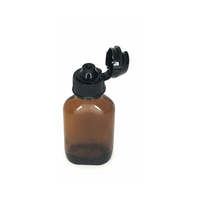 Skwert Aroma Topper Large Thread Bottle Adapter on amber glass bottle, flip-top cap for easy dispensing.