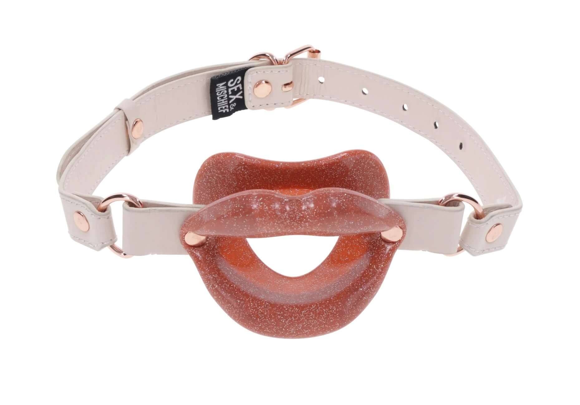 Silicone lips gag in pink with faux leather buckle for secure fit, perfect for flirty and playful oral fun.