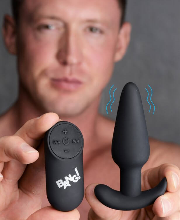 Bang 21x Silicone Butt Plug With Remote Black displayed next to the remote control for powerful backdoor pleasure.