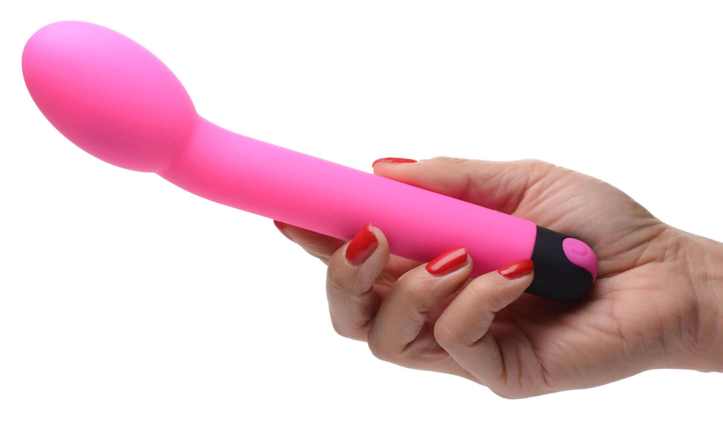 Bang 10X Rechargeable Silicone G-Spot Vibrator Pink held in a hand, showcasing its ergonomic design and vibrant color.