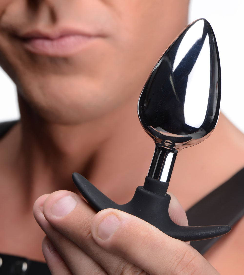 Person holding a Dark Invader Metal and Silicone Anal Plug Large, showcasing its sleek design and premium materials.