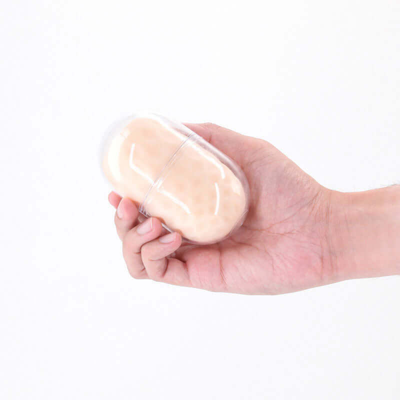 Pocket Pals Handy Strokers Diamond White held in hand, showcasing its compact design and soft texture.