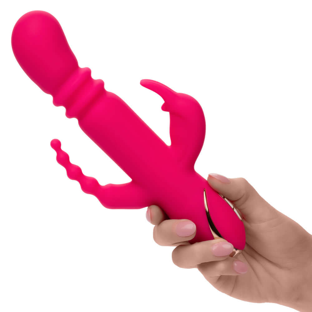 Jack Rabbit Signature Heated Silicone Triple Fantasy Rabbit in pink held in hand
