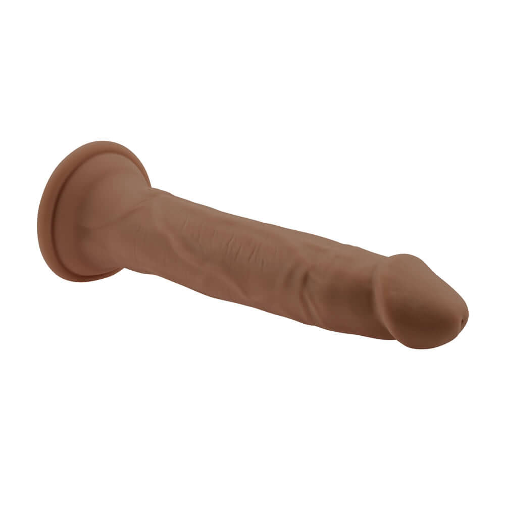 Dark vibrating thruster with realistic vein textures and crown-ridged tapered tip, featuring powerful suction cup base and remote control.