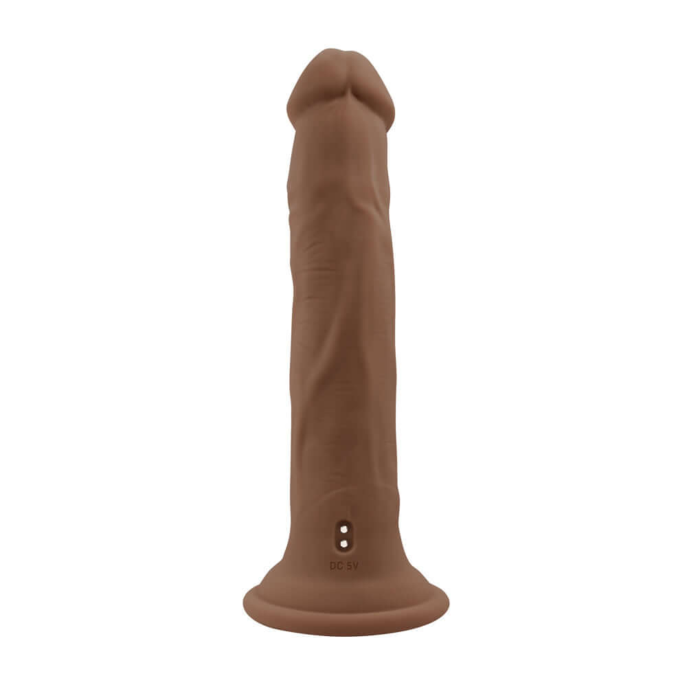 Dark vibrating thruster with realistic veins and crown-ridged tip, featuring a powerful suction cup base and remote control for hands-free use.