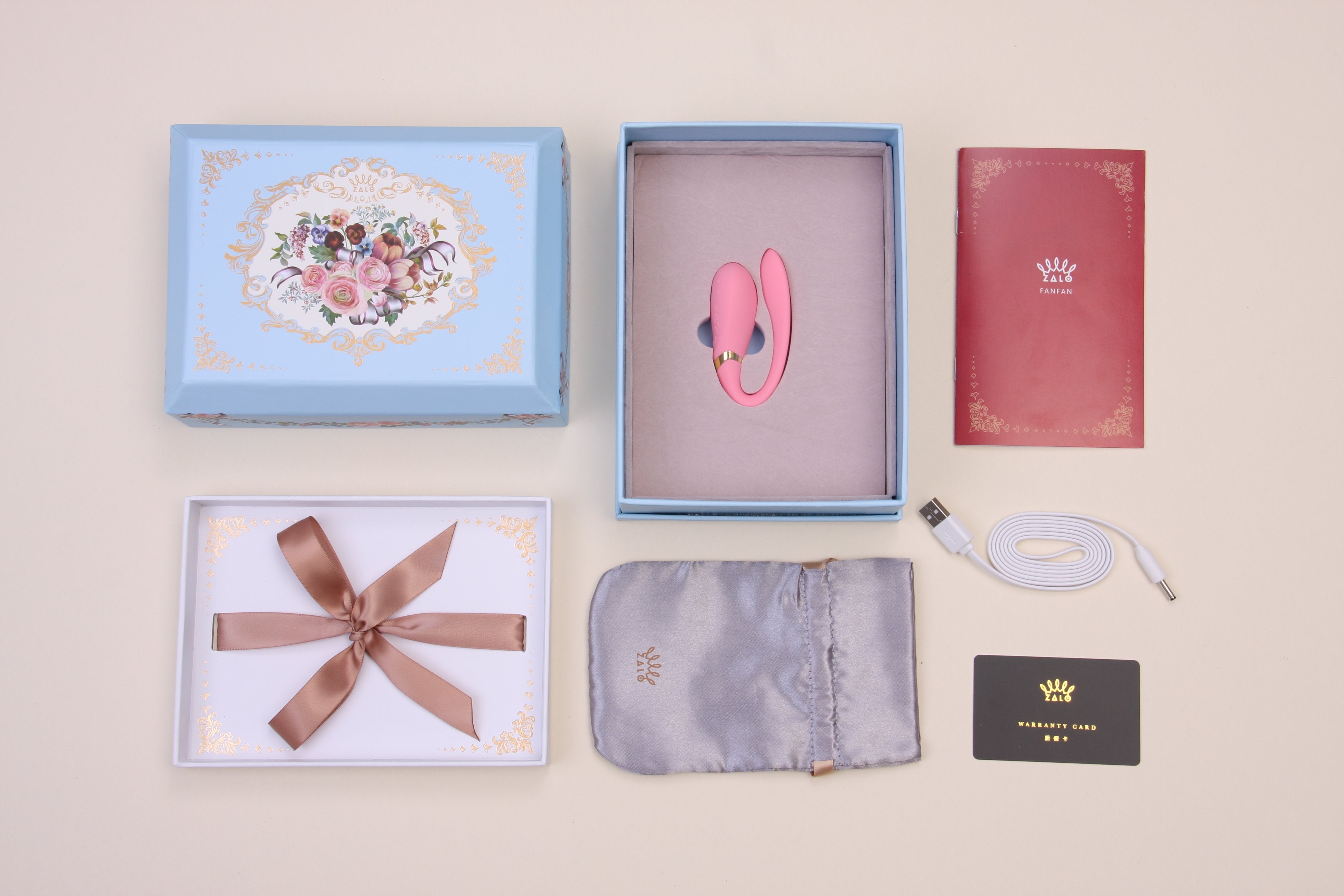 ZALO Fanfan App-controlled Rechargeable Couples Massager Rogue Pink with packaging, charger, storage pouch, and instruction manual.