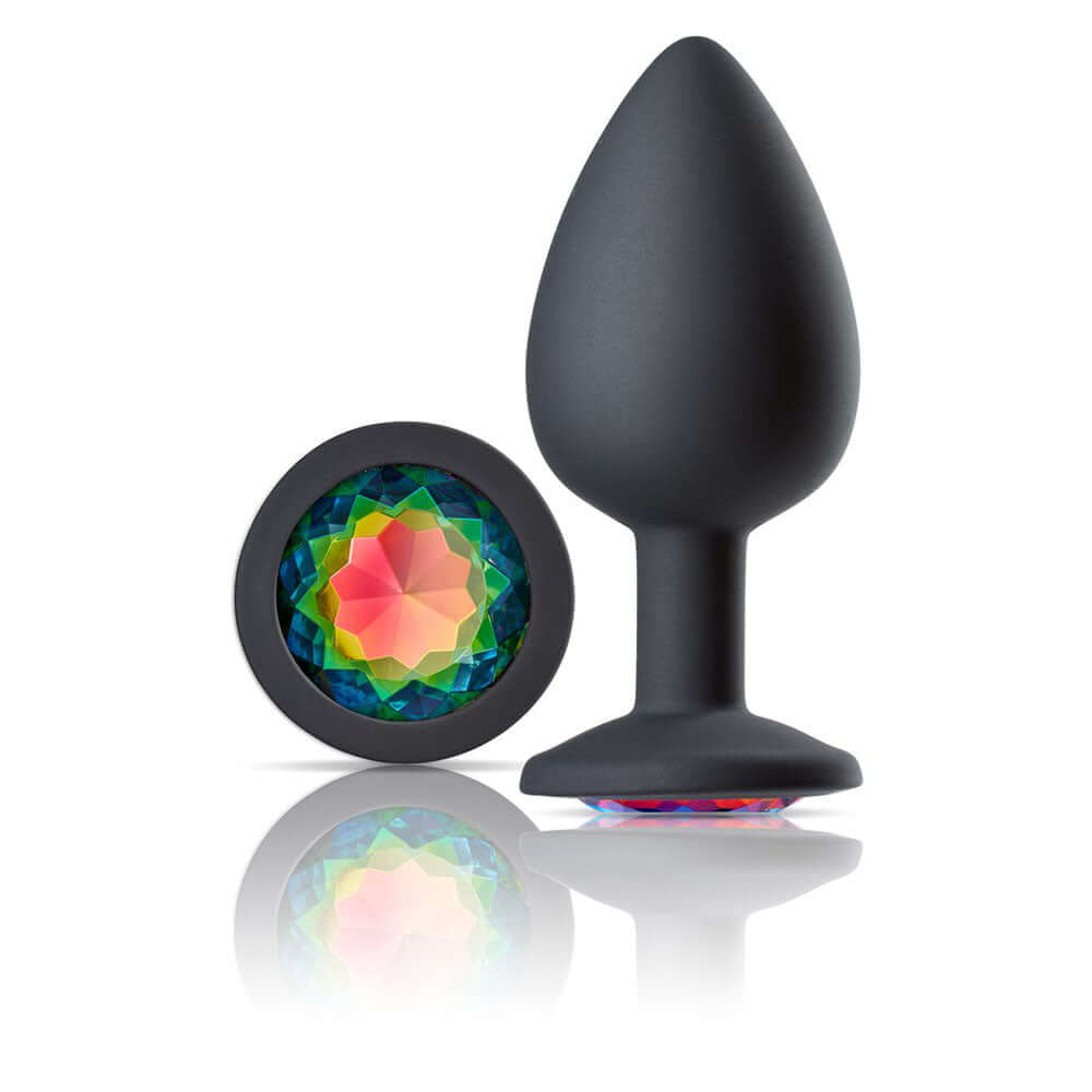 Large black silicone anal plug with rainbow multicolor gem, featuring a tapered tip and flared base, by Cloud 9 Novelties.