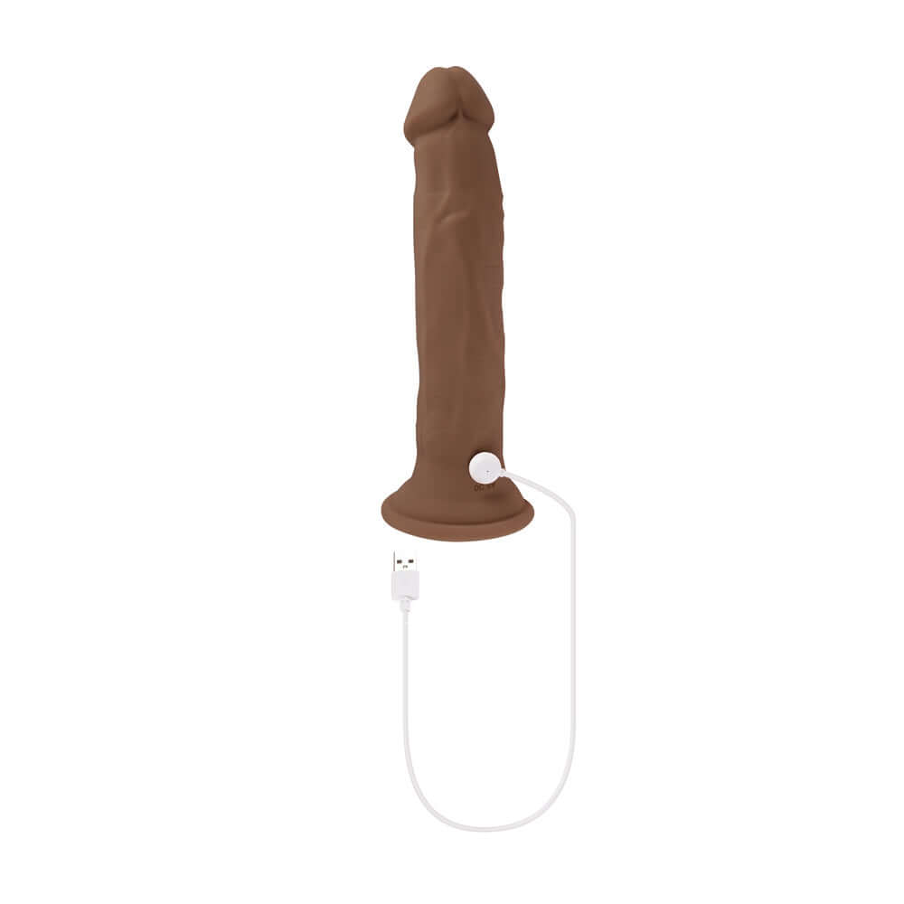 Dark vibrating thruster with realistic veins, suction cup base, and USB charging cable