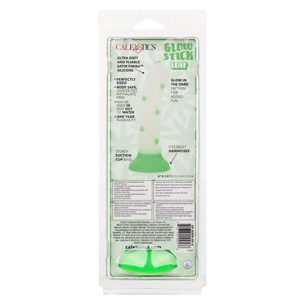 Glow Stick Leaf Dildo - Green in packaging with glow-in-the-dark leaf pattern, ultra-soft satin finish silicone, and sturdy suction cup.