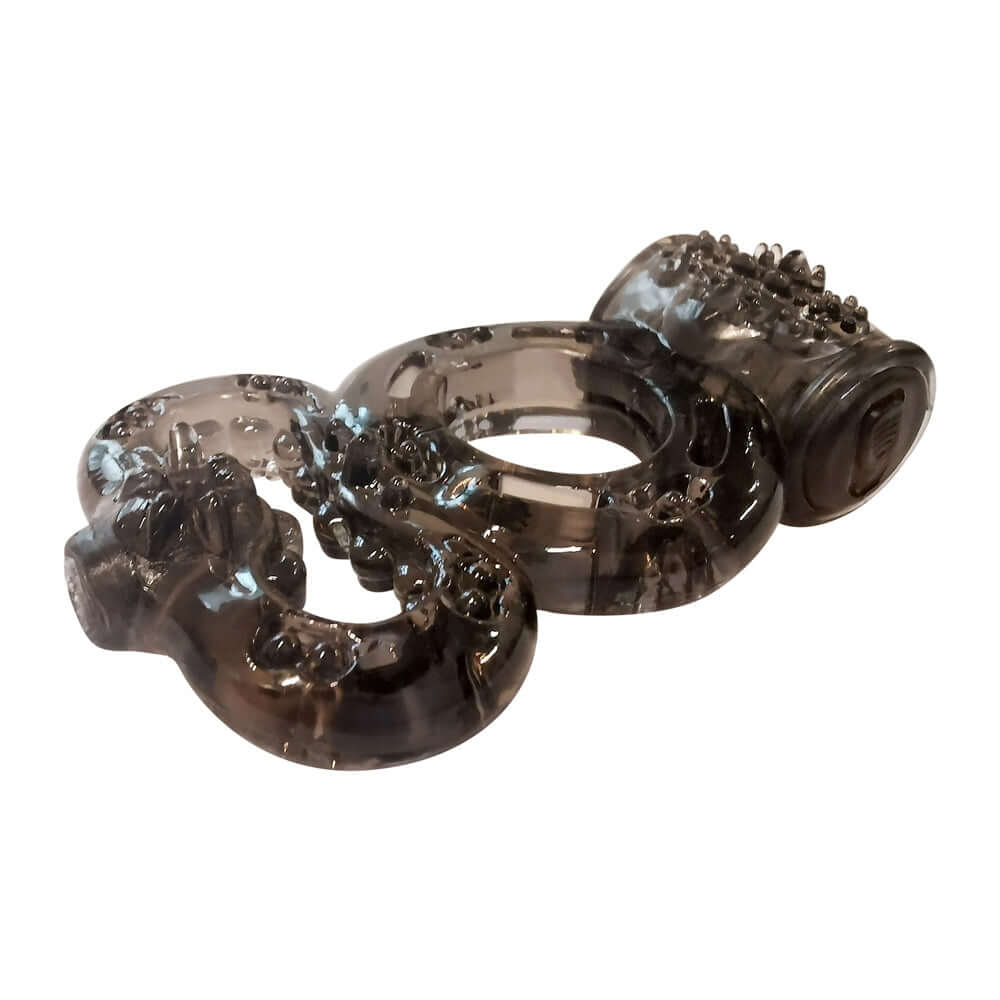 Transparent textured light stroker ring with intricate detailing for enhanced pleasure.