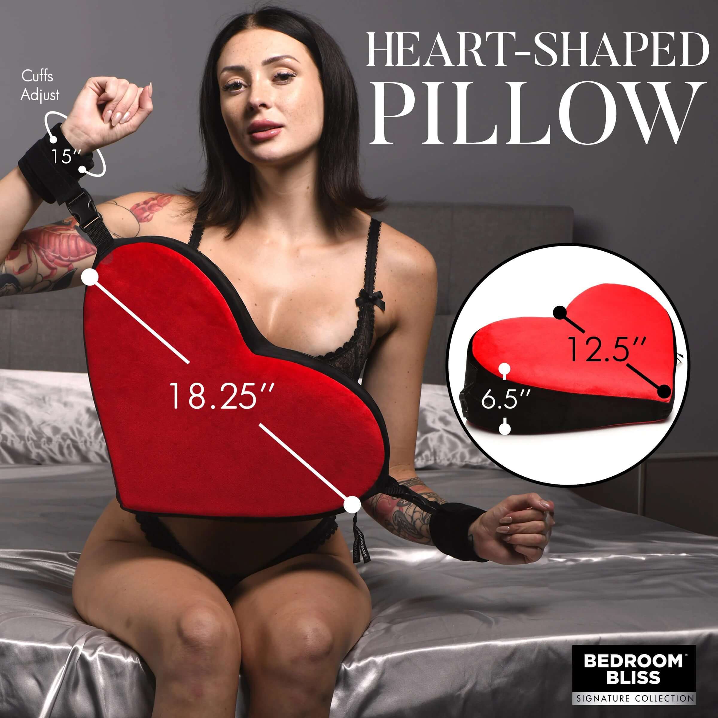 Woman with Bondage Love Pillow - Black/red, heart-shaped, shown with cuffs and measurements. Suitable for varied positioning and support.
