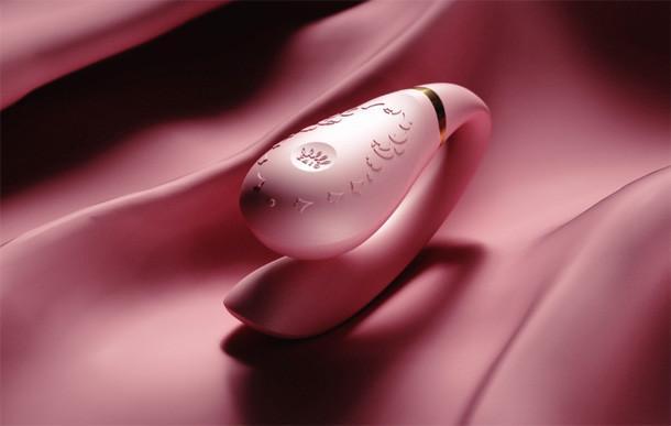 ZALO Fanfan Rogue Pink Couples Massager on pink satin fabric