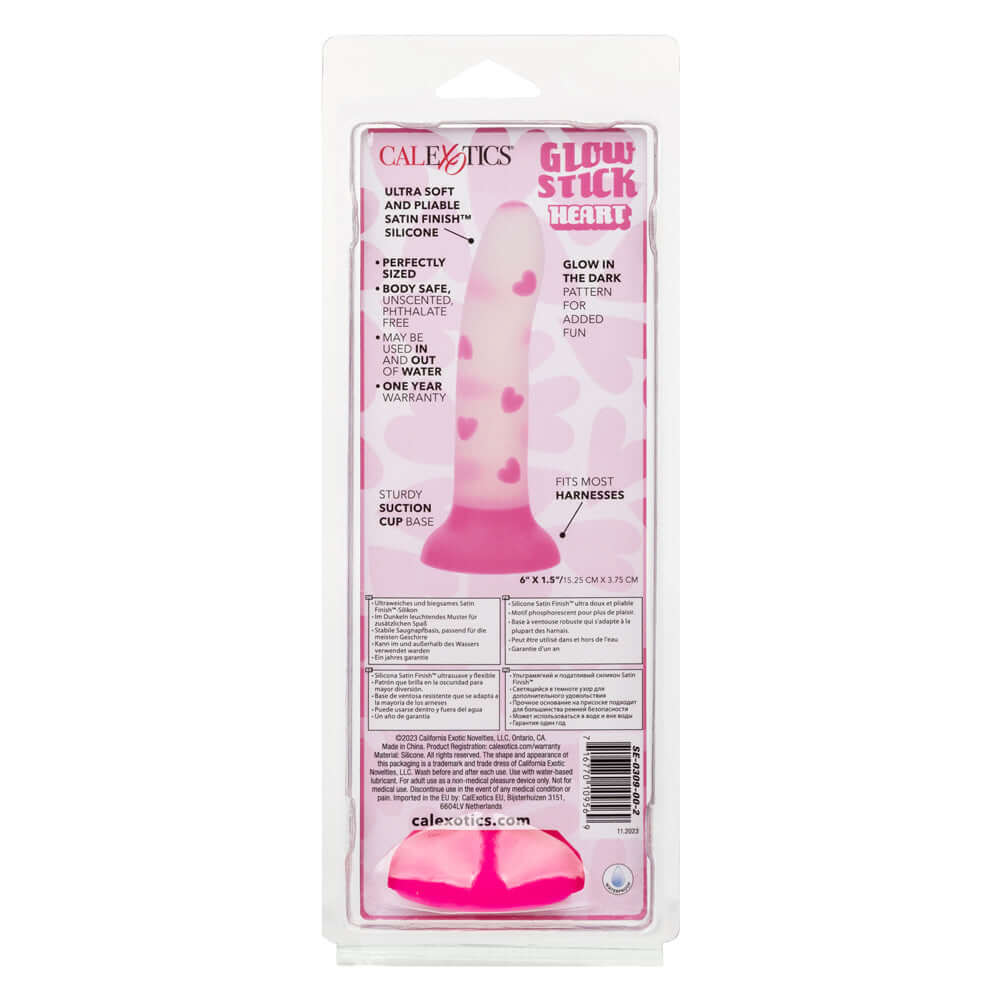 Glow Stick Heart Dildo - Pink in packaging with glow-in-the-dark heart pattern, made from ultra-soft Satin Finish Silicone for added pleasure.
